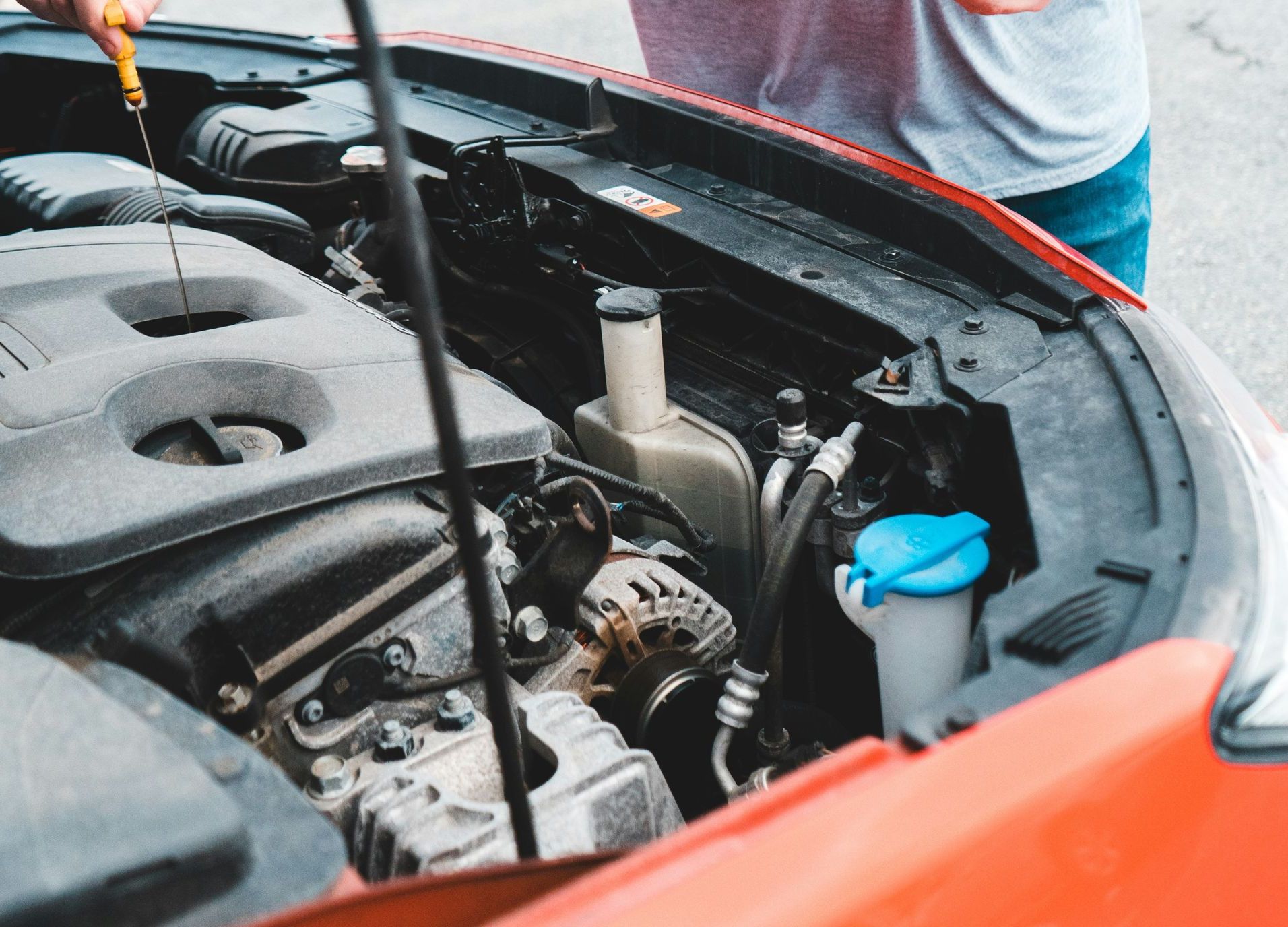 a man is working on a car engine
